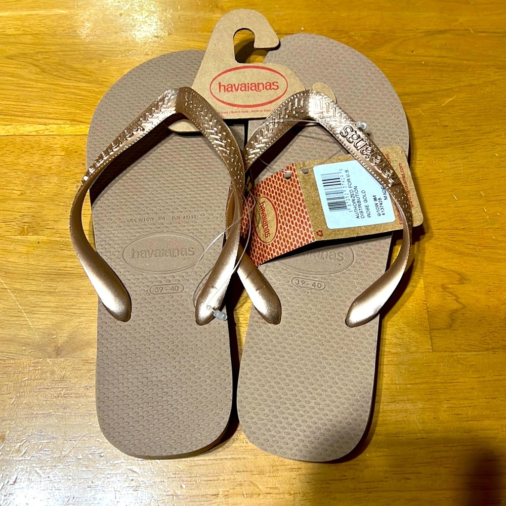 Woman’s rose gold sandals with all original packaging